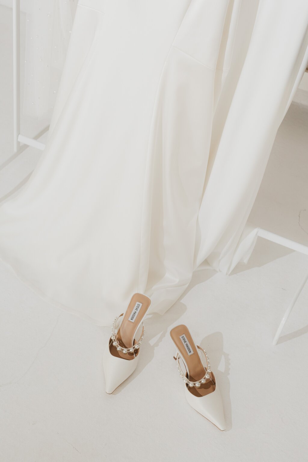 Bridal shoes and the dress at the getting ready in berlin right before the wedding starts.