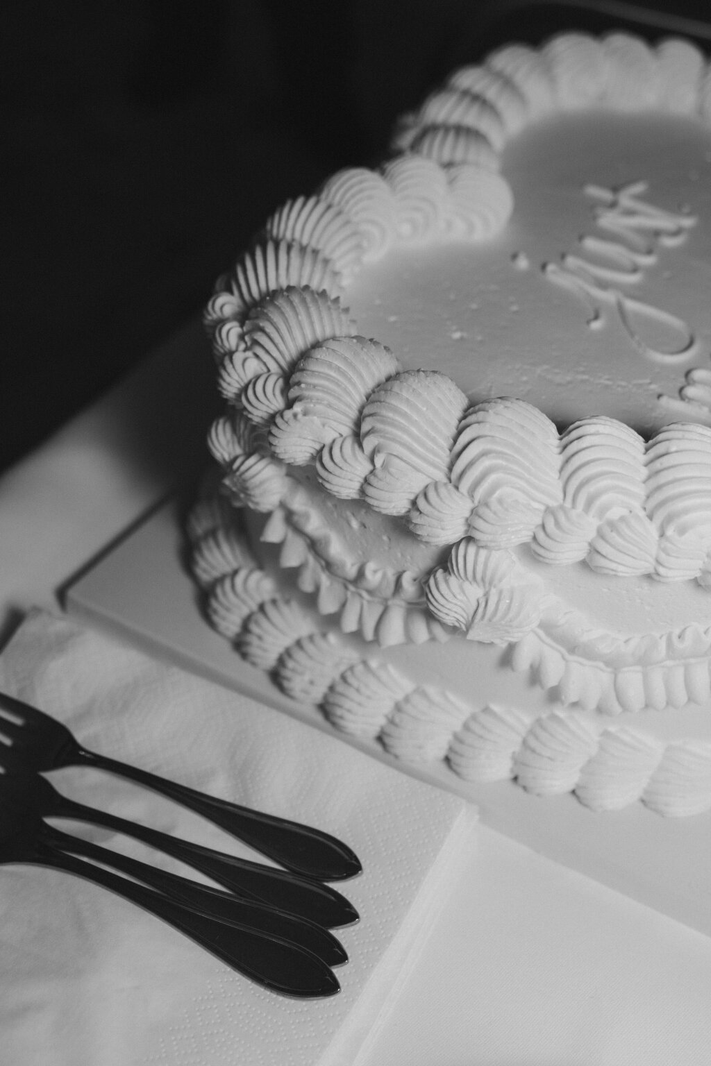 a wedding cake captured in black and white.